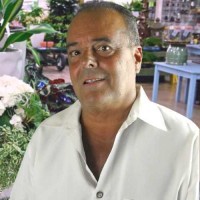 Gene Collins Very tan man with receding gray hair